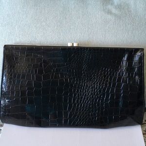 Black large faux patent leather clutch.